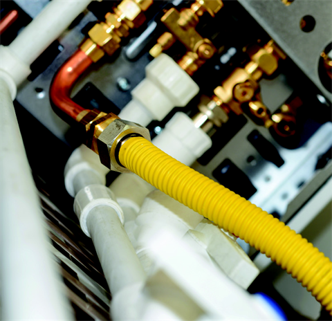 Yellow pipes to copper pipes with white PVC pipes all around